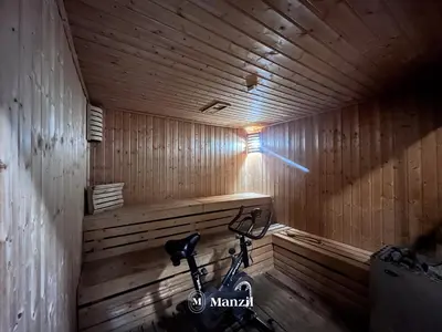 a bike is parked in a wooden sauna at 1BR Apartment in JLT 2km to JBR Beach & Blue Waters Dubai in Dubai