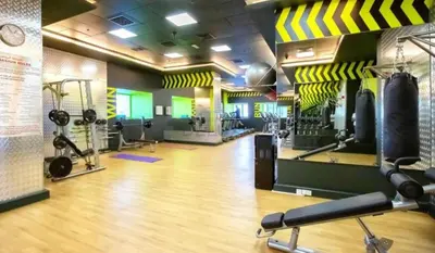 a gym with lots of gym equipment in a room at Refurbished 1BR High-Floor Unit with Partial City & Sea Views, Walking Distance to the Beach, Elite Residence, Dubai Marina by Deluxe Holiday Homes in Dubai