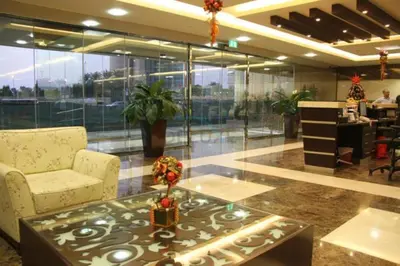a lobby with a chair and a coffee table at Refurbished 1BR High-Floor Unit with Partial City & Sea Views, Walking Distance to the Beach, Elite Residence, Dubai Marina by Deluxe Holiday Homes in Dubai