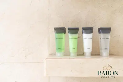 four tubes of hair products sitting on a shelf at The Exquisite in Dubai