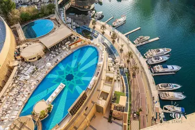 an overhead view of a marina with boats in the water at The Exquisite in Dubai