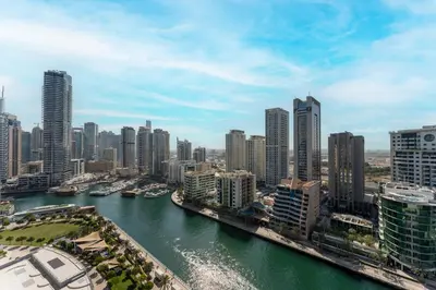 a view of a city with a river and buildings at HAVN - 2-Storey Apartment with Dubai Marina Views in Dubai