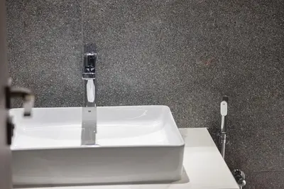 a bathroom sink with a faucet on a counter at Modern & Luxurious Studio - Near CircleMall in Dubai