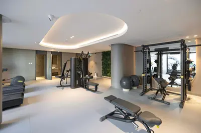 a gym with treadmills and cardio equipment in a room at Modern & Luxurious Studio - Near CircleMall in Dubai
