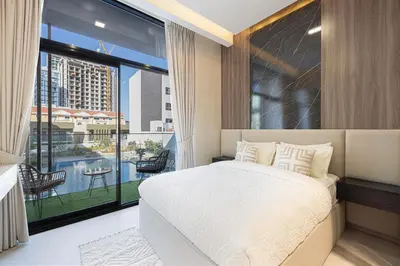a bedroom with a bed and a large window at Modern & Luxurious Studio - Near CircleMall in Dubai