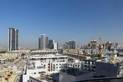 an aerial view of a city with tall buildings at Elegant 1BR in JVC in Dubai