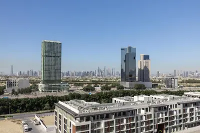 a view of a city skyline with tall buildings at Elegant 1BR in JVC in Dubai