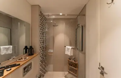 a bathroom with a shower with a glass door at 2 bedroom apartment Dubai Hills in Dubai