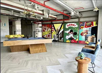 a room with a ping pong table and a mural at 2 bedroom apartment Dubai Hills in Dubai