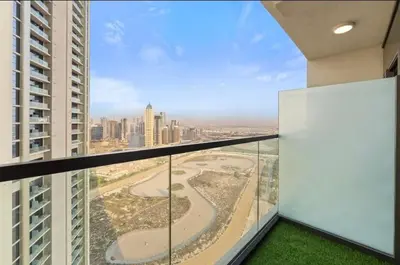a balcony in a building with a view of a city at Luxury 2BR above the clouds on38 in Dubai