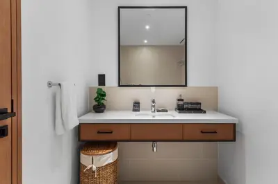 a bathroom with a sink and a mirror at Novity Signature Homes in Dubai