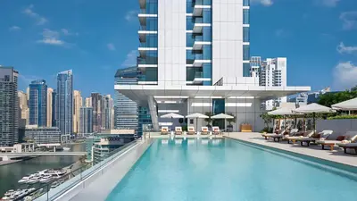 a hotel swimming pool with a view of a city at Novity Signature Homes in Dubai