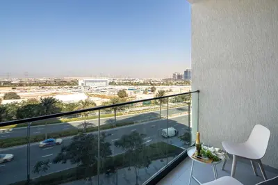 a balcony with a view of a city at Frank Porter - Prive Residence in Dubai