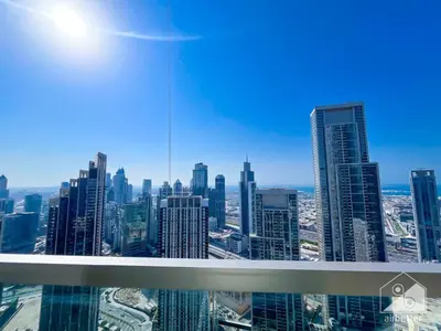 a view of a city skyline from a skyscraper at Luxury 1BR at Grande Downtown with Iconic Views in Dubai
