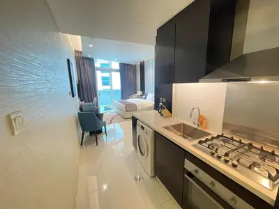 a kitchen with a sink and a stove top oven at Unmatched luxury perfectly located next to Dubai Mall and Burj Khalifa in Dubai