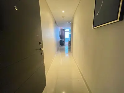a hallway with a door and a chair in a room at Unmatched luxury perfectly located next to Dubai Mall and Burj Khalifa in Dubai