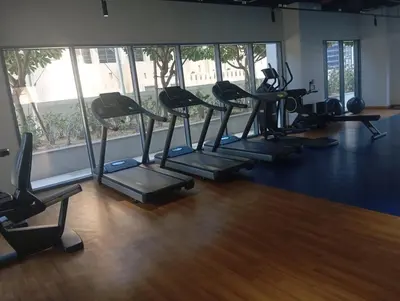 a gym with treadmills and ellipticals in a room at Lux 1BR Apt with BurjKhalifa Views in DowntownDubai in Dubai