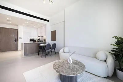 a living room with a couch and a table at Binghatti House in JVC - New Apartment in Dubai