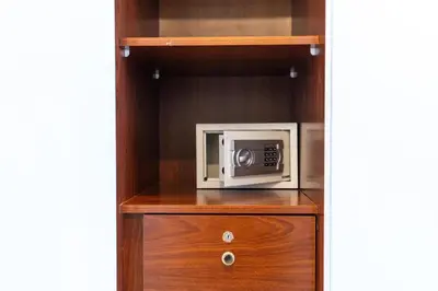 a microwave oven sitting on top of a wooden cabinet at Stylish 1-Bedroom with Breathtaking Views at Dubai Marina in Dubai