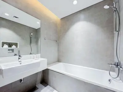 a bathroom with a tub and a sink and a shower at Azure - 1-Bed Luxury by Crystal Lagoon, Downtown in Dubai