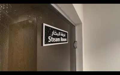 a sign on the door of a room at Great deal Magnificent Brand New with Private PooL in Dubai