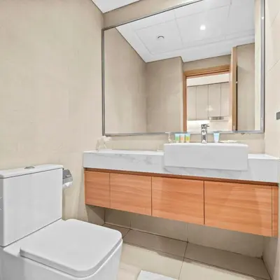 a bathroom with a sink and a toilet at Azizi Riviera 35 - Studio with full Kitchenet - Ideal for monthly in Dubai