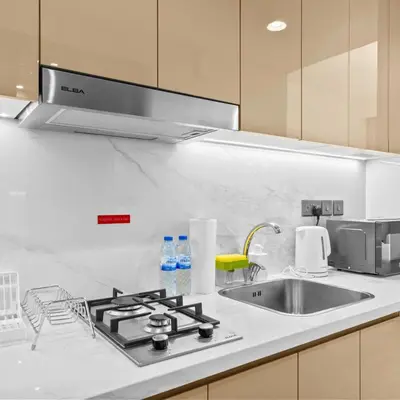 a kitchen counter with a sink and a stove at Azizi Riviera 35 - Studio with full Kitchenet - Ideal for monthly in Dubai