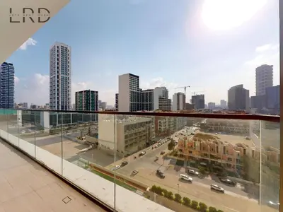 a view of a city from the top of a building at Modern Smart Home 2BR with Private Pool in JVC in Dubai