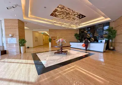a lobby with a table in the middle of a building at Capital Bay Tower B Comfort Studio in Dubai