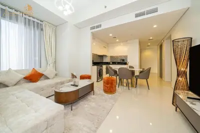 a living room with a couch and a table at Luxury Sea View High Floor 3Bhk in Dubai