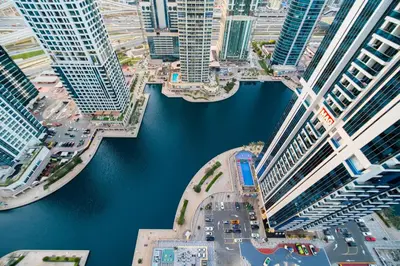 an aerial view of a city with tall buildings at SettlerHomes - Chic JLT 29 Floor Near Panoramic Lake in Dubai