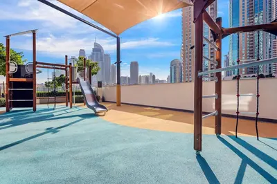 a playground on the roof of a building at FIRST CLASS 2BR Burj Khalifa & Fountain view in Dubai