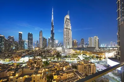 a view of a city skyline with a tall skyscraper at Burj Royale Lux 2-bedroom apartment with the best Burj Khalifa view in Dubai