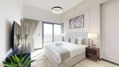 a white bedroom with a large bed and a window at Mag Eye 910 - Magnificent One Bedroom in Meydan in Dubai