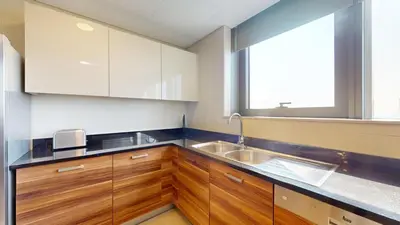 a kitchen with a sink and a window at Vacationer I Luxury 2BR I Marina Views I Close to JBR Beach I Sparkle Tower in Dubai