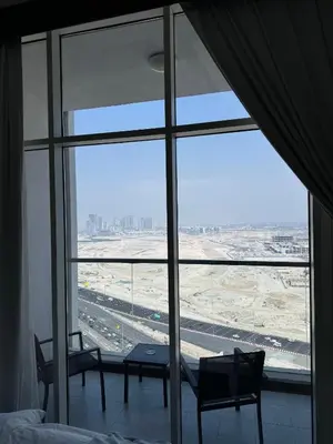 a room with a large window looking out at an airport at Bayz Business Bay Lux Studio with Resort Amenities in Dubai