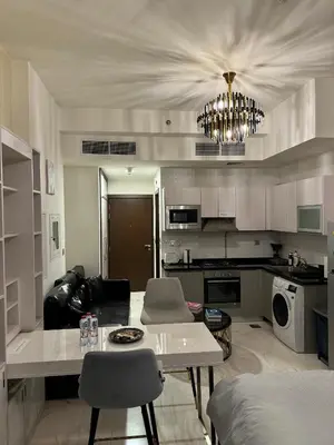 a living room with a couch and a table at Bayz Business Bay Lux Studio with Resort Amenities in Dubai