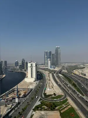 an aerial view of a city with roads and buildings at Bayz Business Bay Lux Studio with Resort Amenities in Dubai