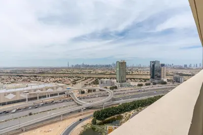 a view of a highway with a city in the background at Ahlan HH - Luxury 2BR Damac Tower 108 at High Floor in Dubai