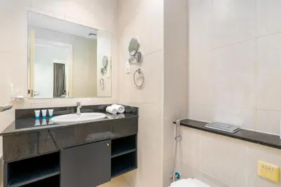 a bathroom with a sink and a mirror at Ahlan HH - Luxury 2BR Damac Tower 108 at High Floor in Dubai