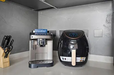 a coffee maker sitting on top of a counter at Stonetree - Cozy 1 BR at MBL Near Metro in Dubai