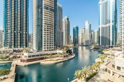 a river in a city with tall buildings at GuestReady - Beautiful home in the JLT area in Dubai