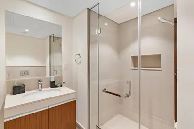 a bathroom with a sink and a shower at Stonetree - Spacious 2BR at Dubai Creek Residences in Dubai