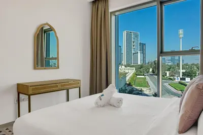 a hotel room with a bed and a large window at Bellavista - 2 Bedroom Downtown Views II T2 in Dubai