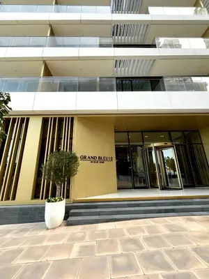 a building with a plant in front of it at 2BD designed by Elie Saab with Private Beach Sea View by EE Holiday Homes in Dubai