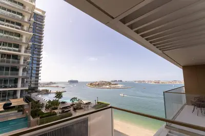 a view of the ocean from the balcony of a building at 2BD designed by Elie Saab with Private Beach Sea View by EE Holiday Homes in Dubai