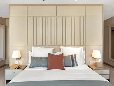 a bedroom with a large white bed with pillows at FIVE luxe JBR - High Floor Studio - Pool & Beach Access - Ventura Stays in Dubai