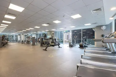 a large gym with cardio equipment in a building at Dubai Marina, Beach & Marina View , 2 Bed Perfect for Groups in Dubai