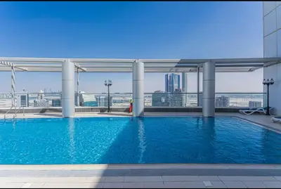 a swimming pool on the roof of a building at 5 minutes walk to Dubai mall and Burj Khalifa in Dubai