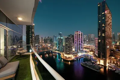 a view of a city at night from a building at Panoramic Marina View - 1BR - Walk to the beach in Dubai